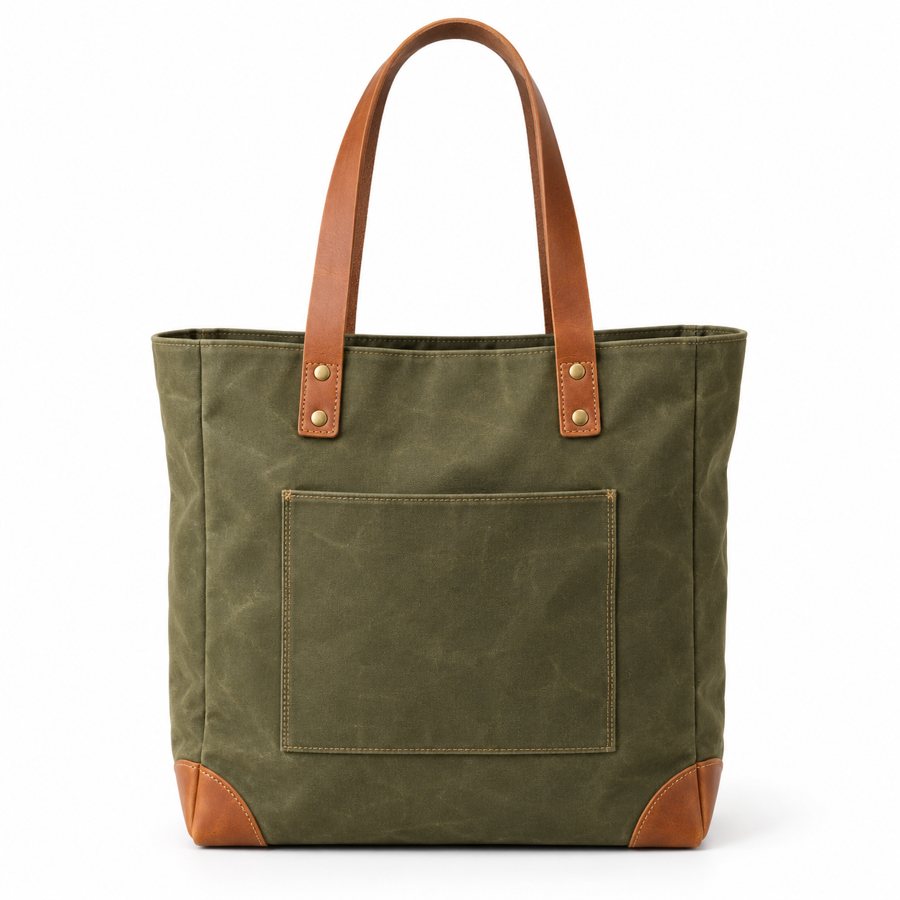 Plain product photo of an olive waxed canvas tote bag on a white background